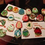 Collection of sugar cookies decorated by members of the lab.